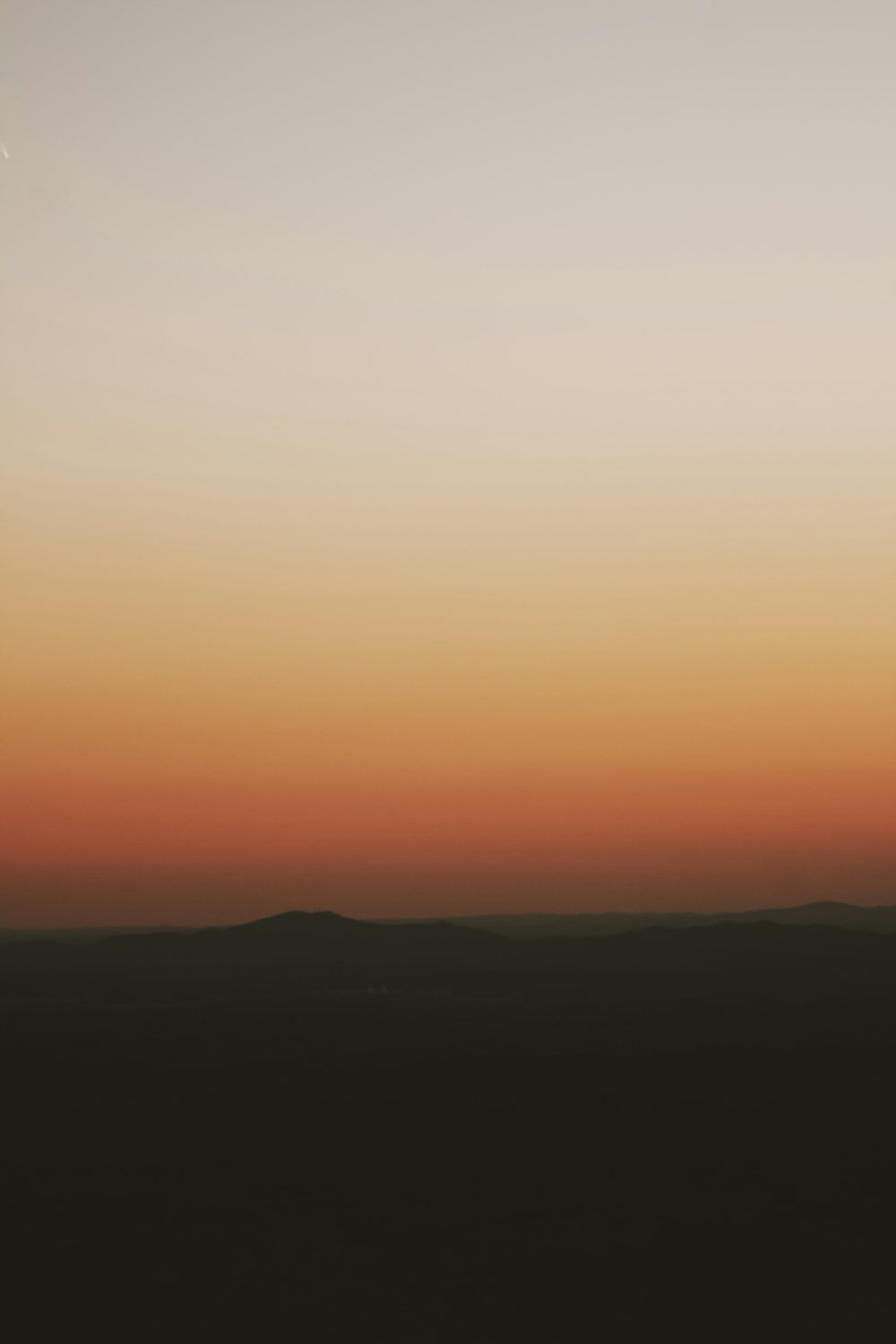 silhouette of mountain during sunset