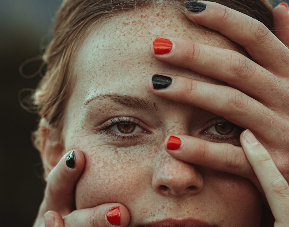 woman with red nail polish