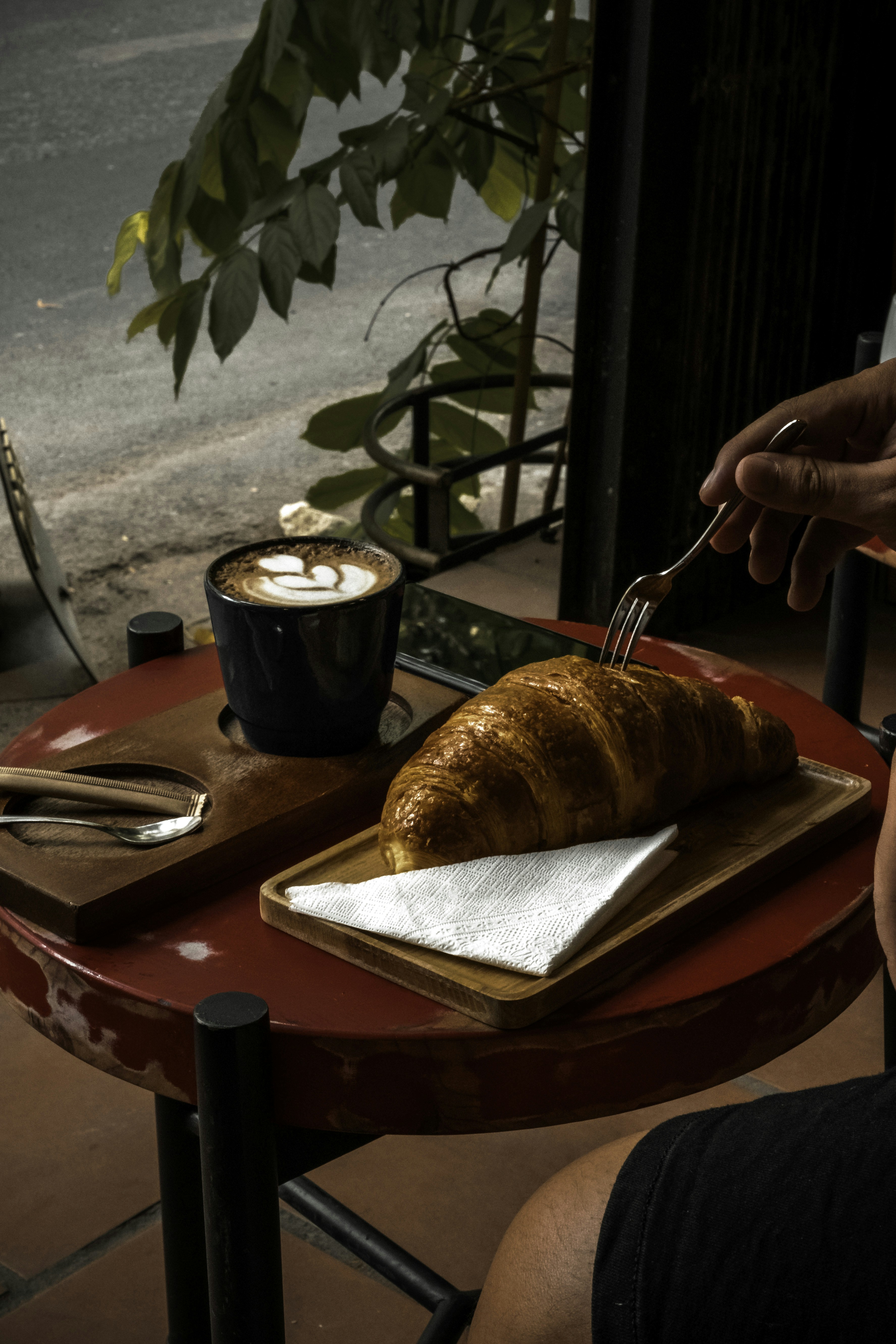 person holding stainless steel fork