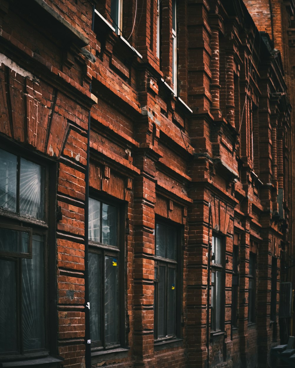 brown brick building with windows