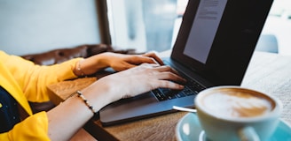 person using black laptop computer