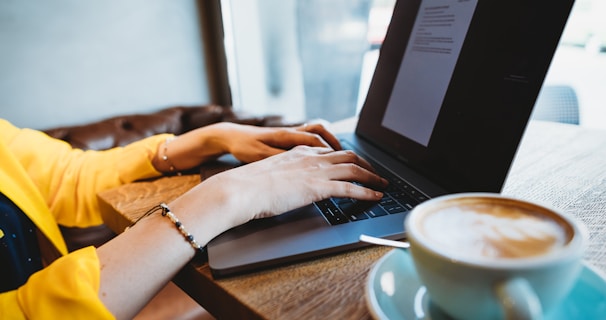 person using black laptop computer