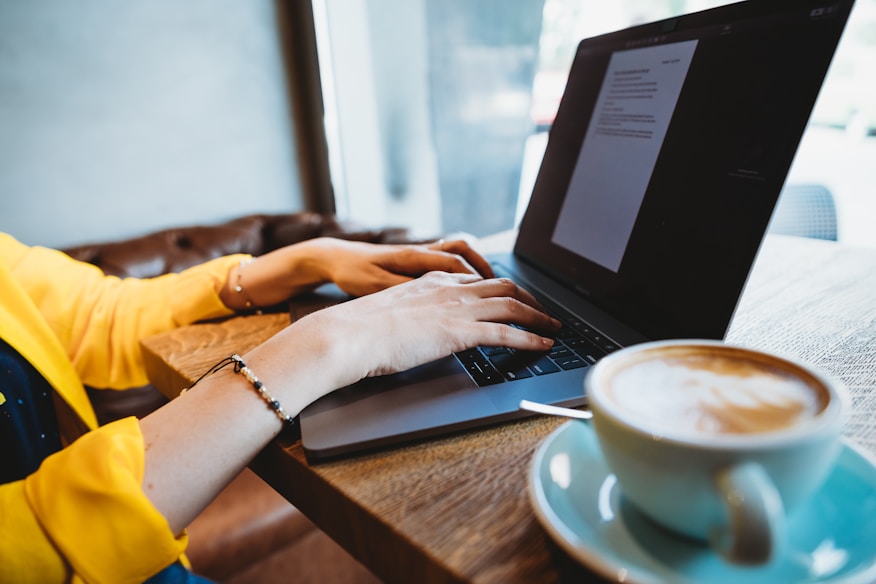 person using black laptop computer