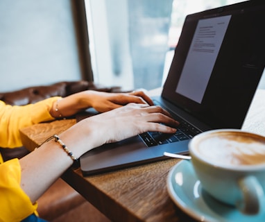 person using black laptop computer