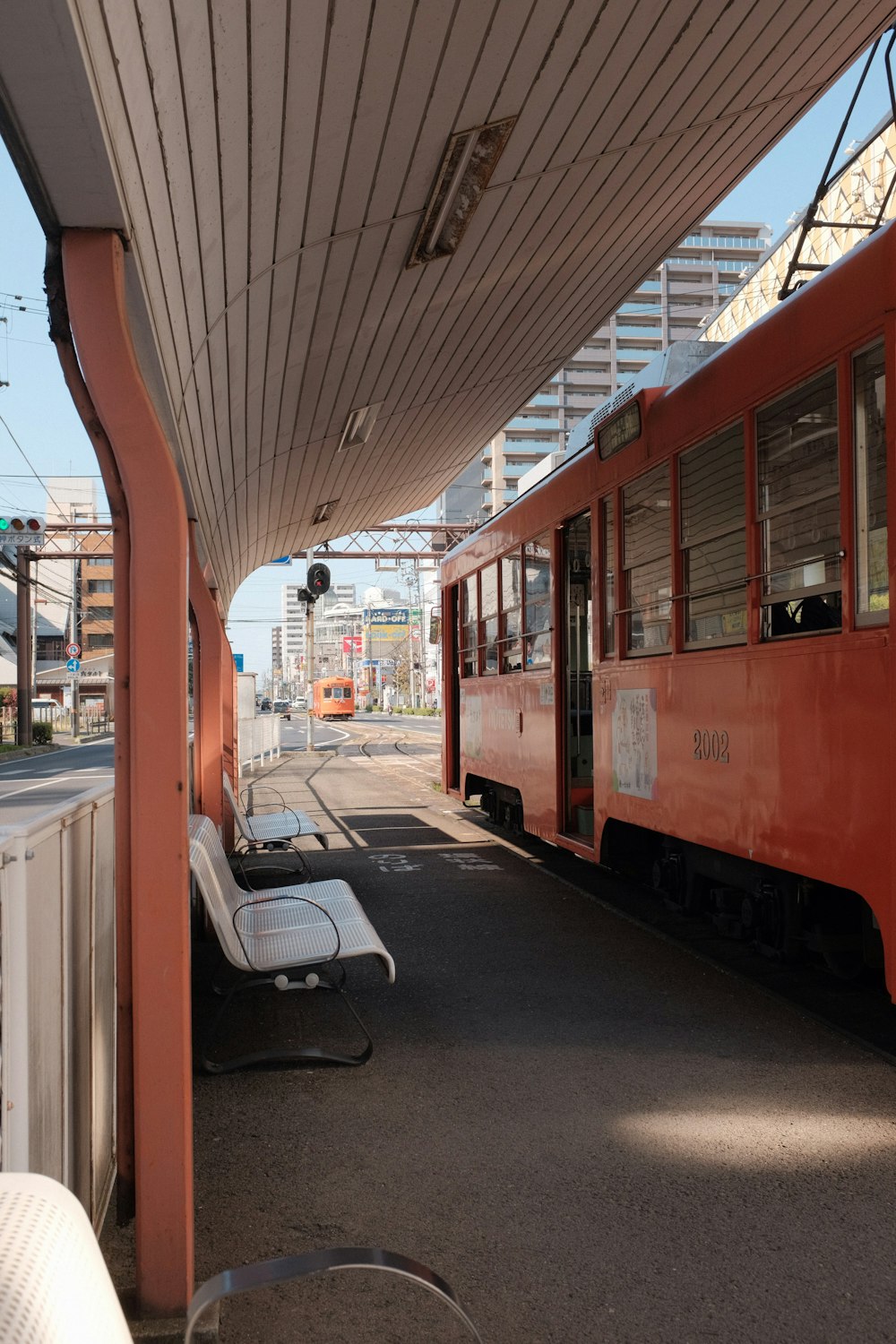 red and white train on train station during daytime