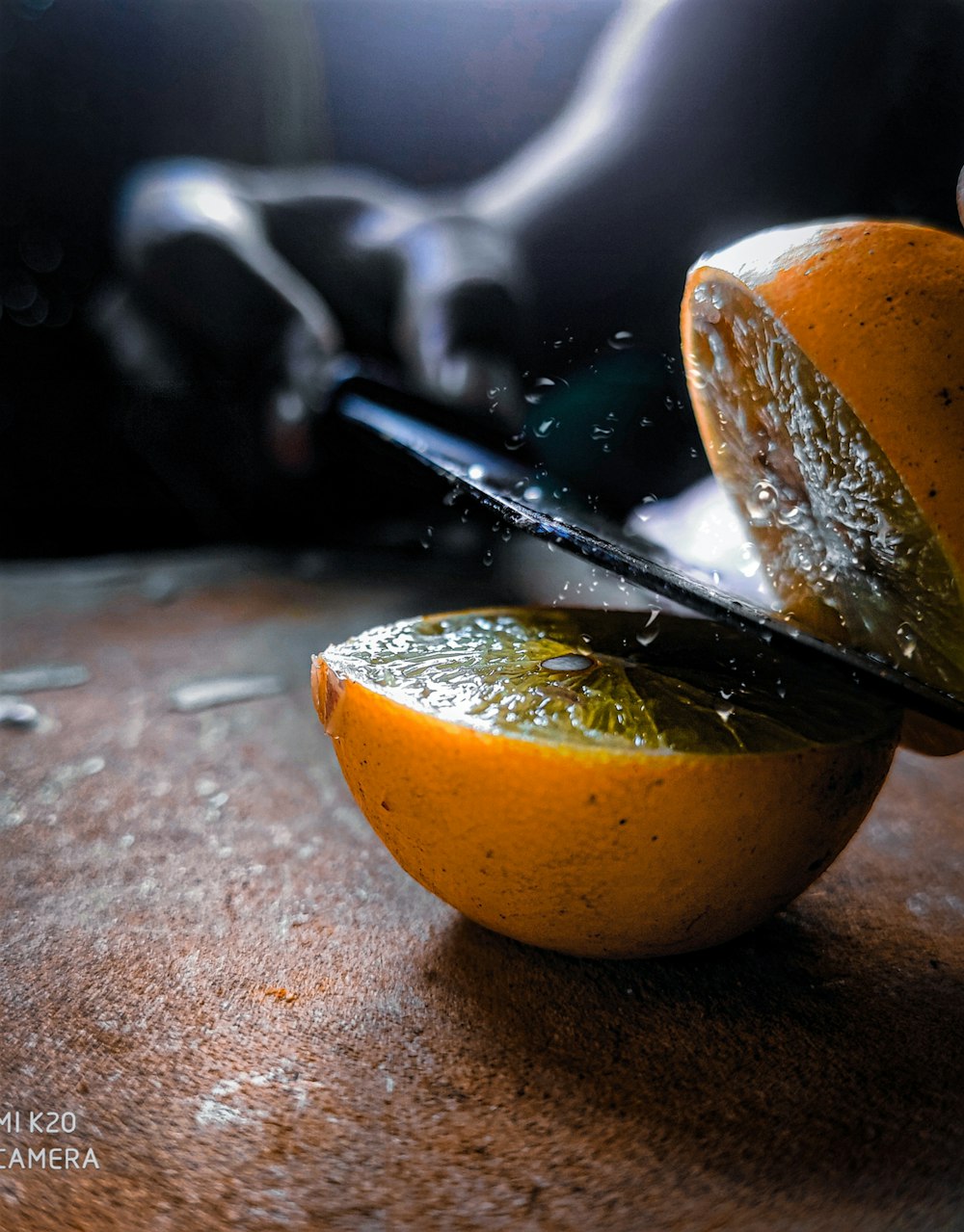 sliced orange fruit on brown wooden table