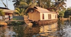 brown wooden house on water