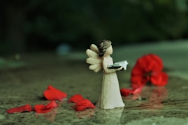 angel ceramic figurine on water