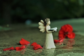 angel ceramic figurine on water