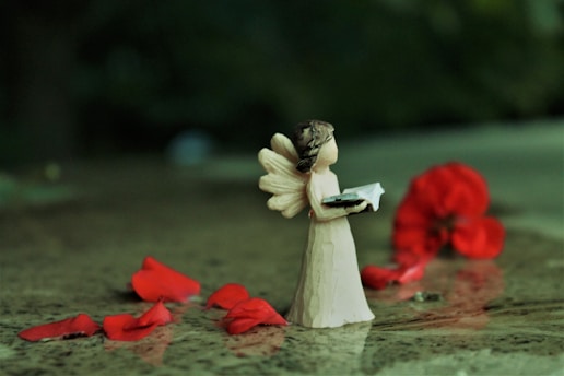 angel ceramic figurine on water