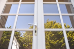 white metal framed glass window