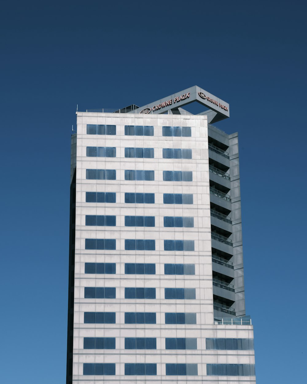 white and black concrete building under blue sky during daytime