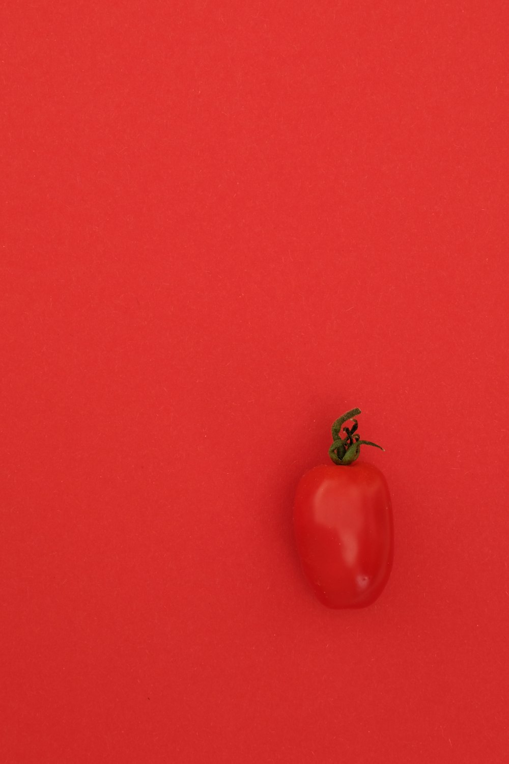 red tomato on red table
