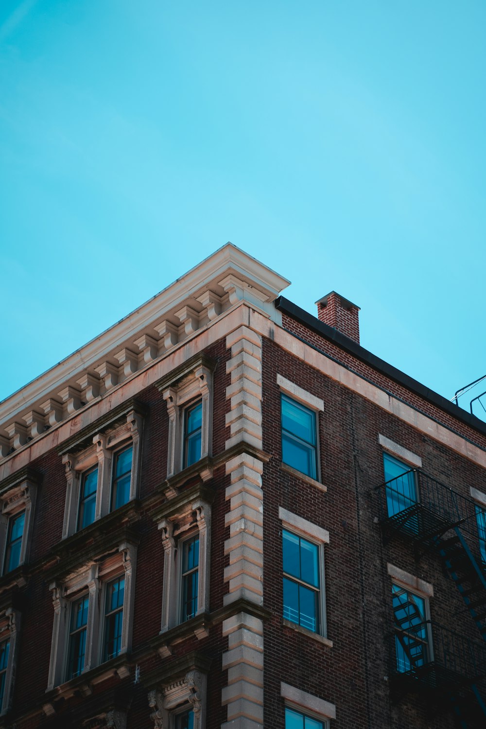 brown concrete building under blue sky during daytime