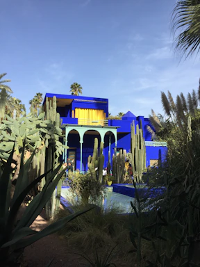 Cozy bungalow surrounded by cacti and blue skies.