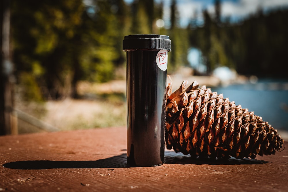 brown pine cone on brown wooden table