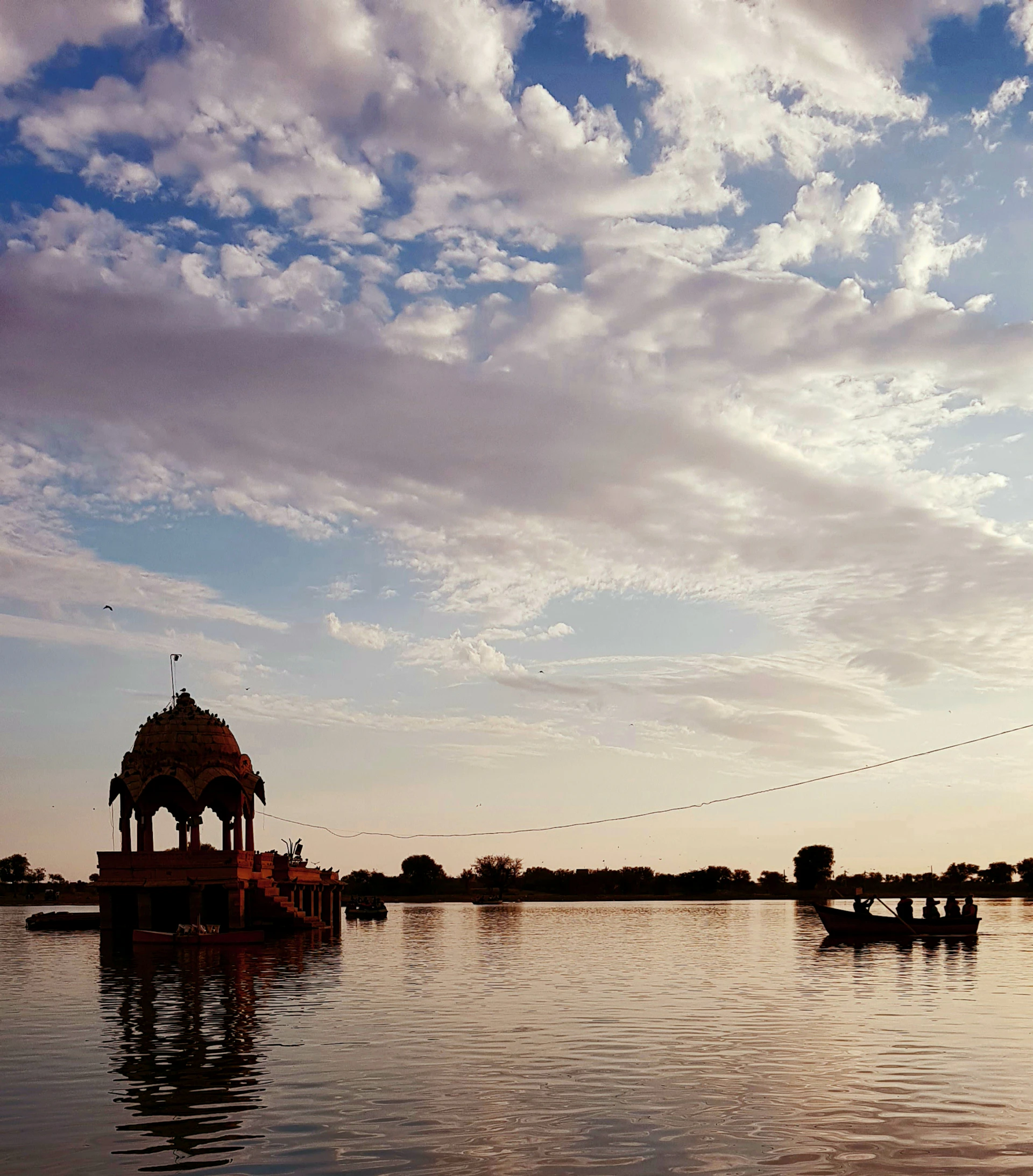 brown wooden dock on body of water during daytime