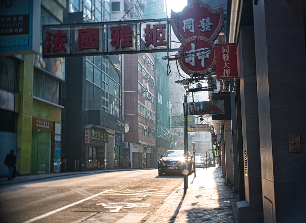 cars on road near buildings during daytime