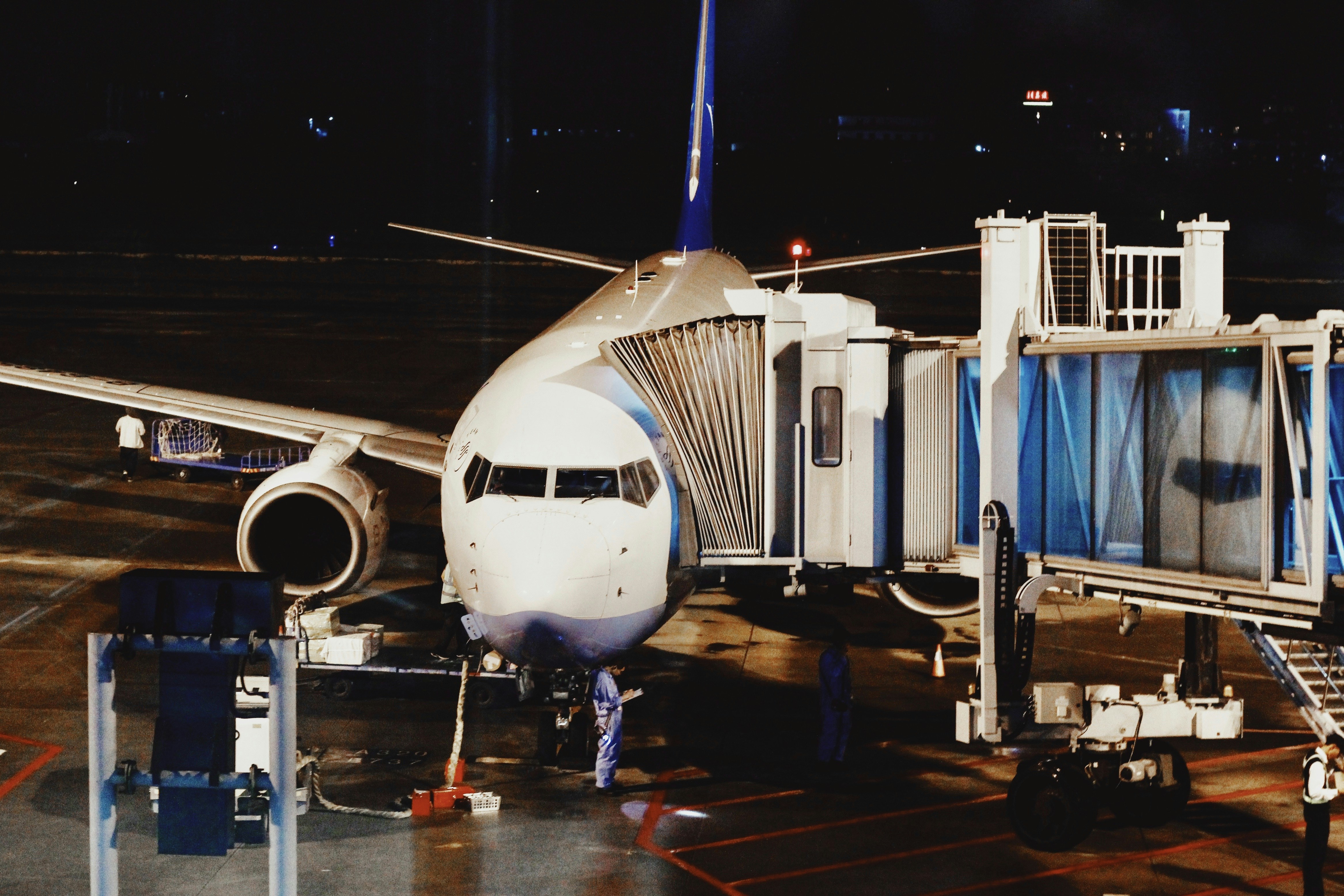white airplane on airport during night time, 