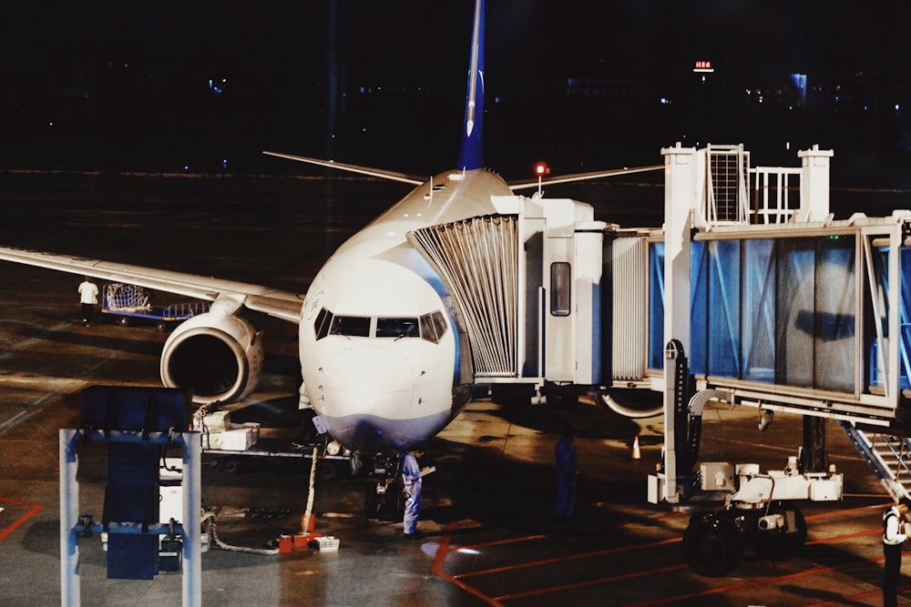 white airplane on airport during night time