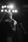 grayscale photo of woman singing