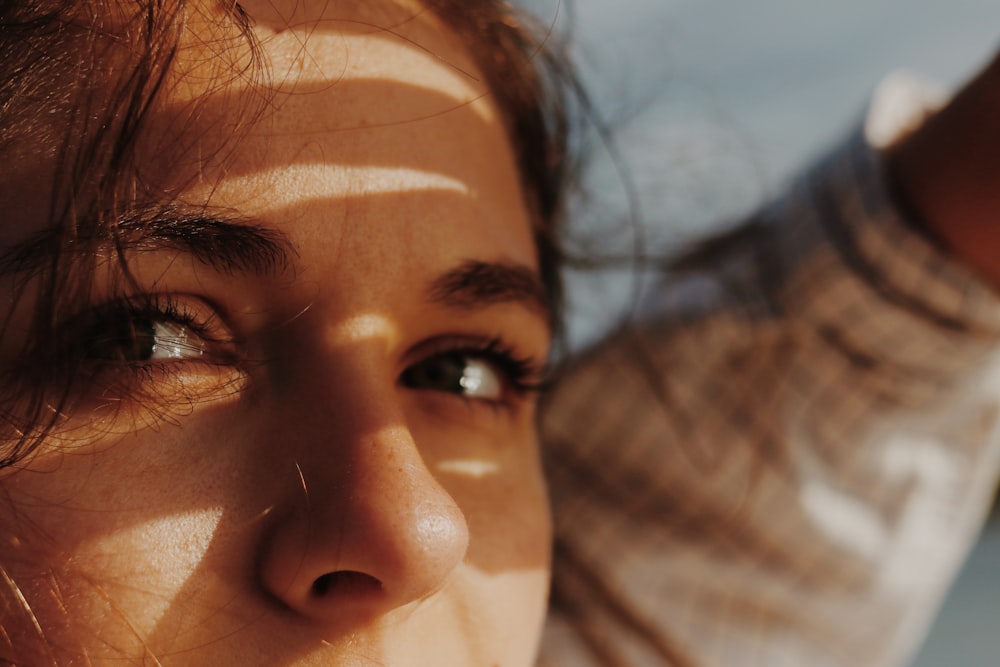 womans face with brown hair