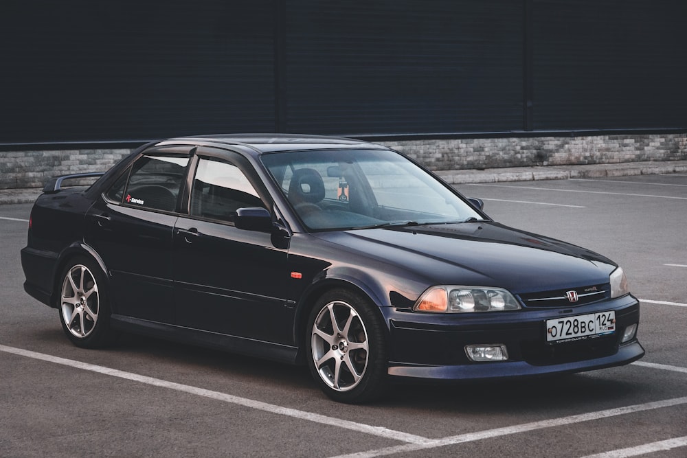 black bmw m 3 coupe parked on gray asphalt road during daytime