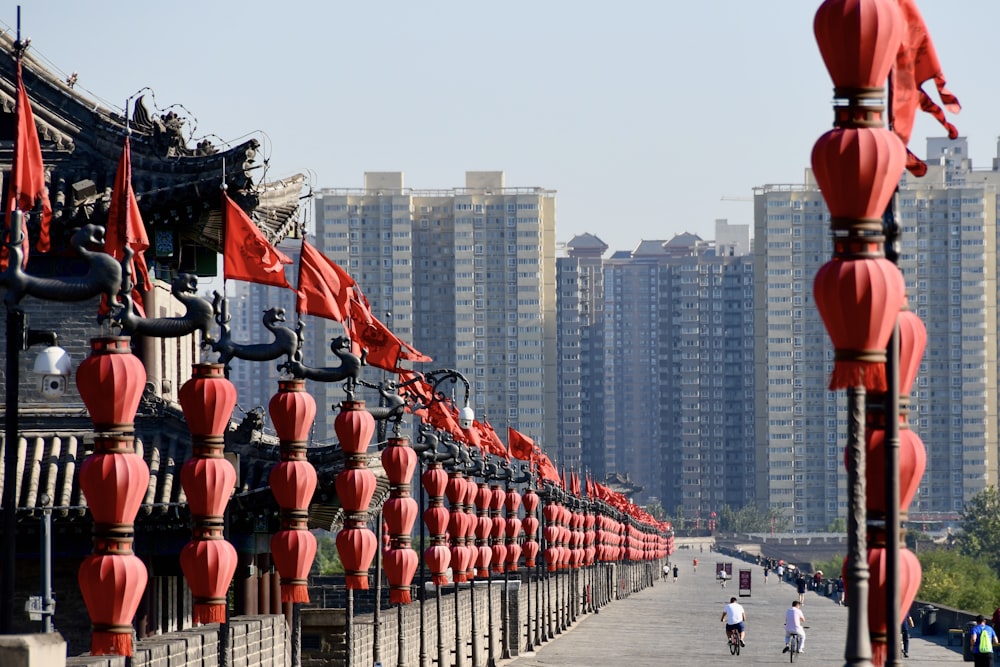 people walking on street near high rise buildings during daytime