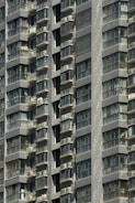 Close-up of a completed residential building facade with balconies.