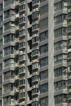Close-up of a completed residential building facade with balconies.