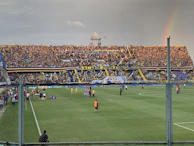 A lively sports event with vivid aqua and yellow branding elements on display.