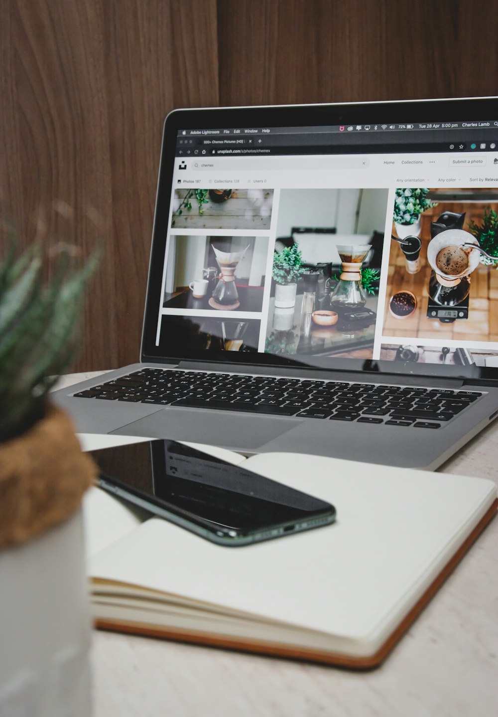 macbook pro beside iphone on table