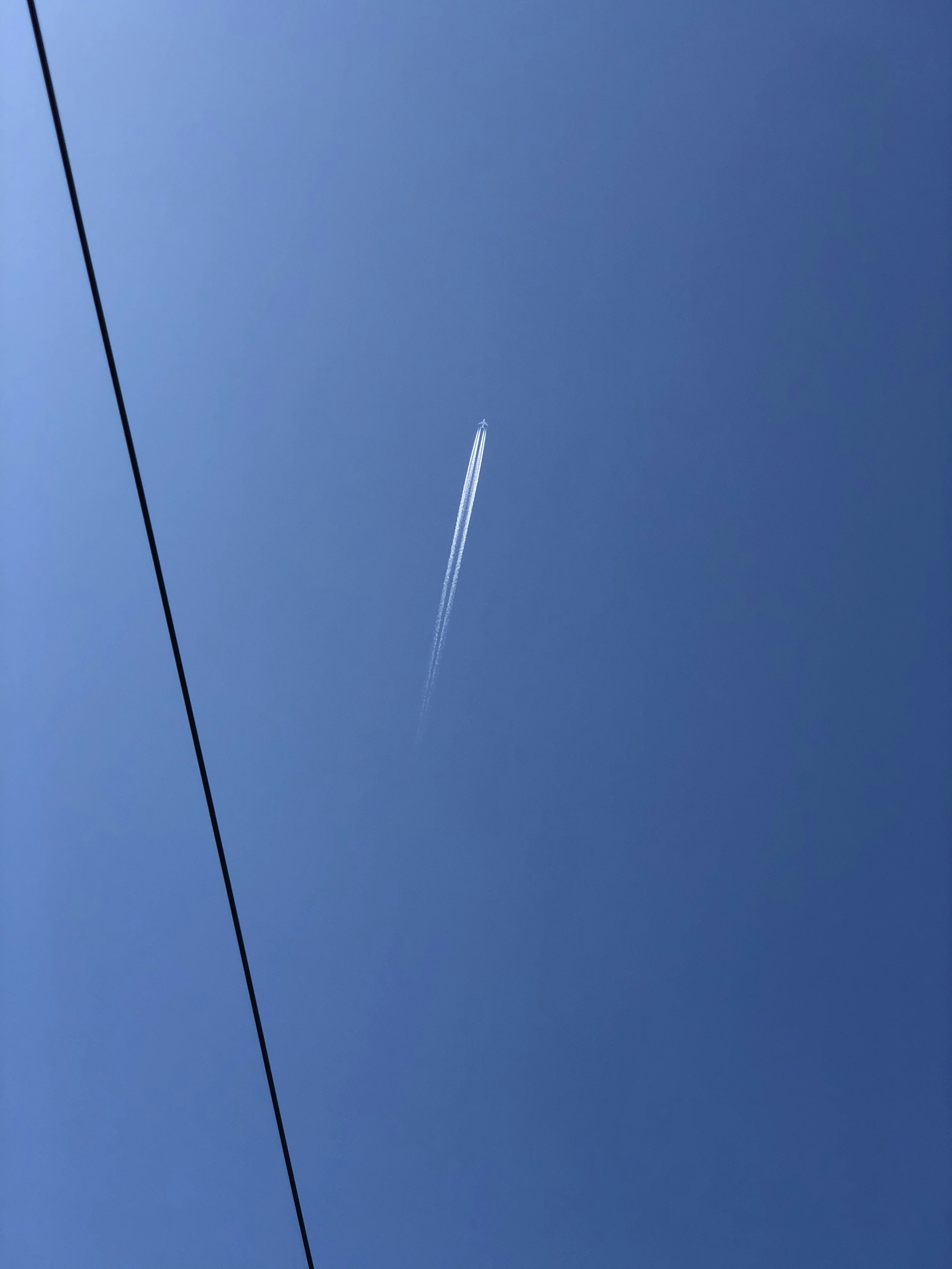 black coated wire under blue sky