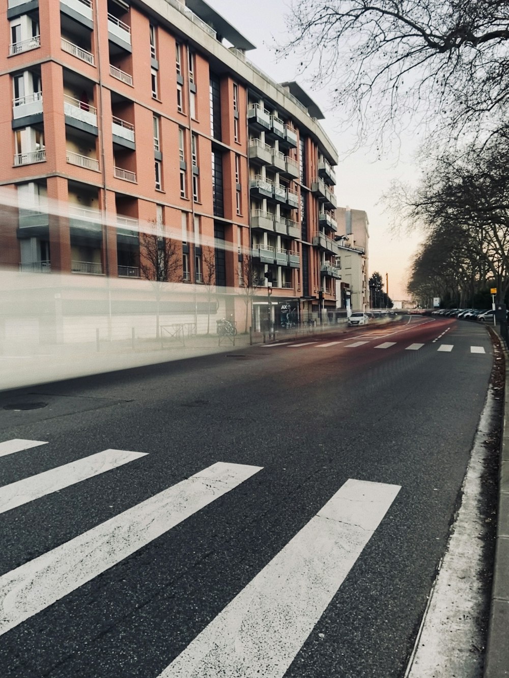 brown and white concrete building beside road during daytime