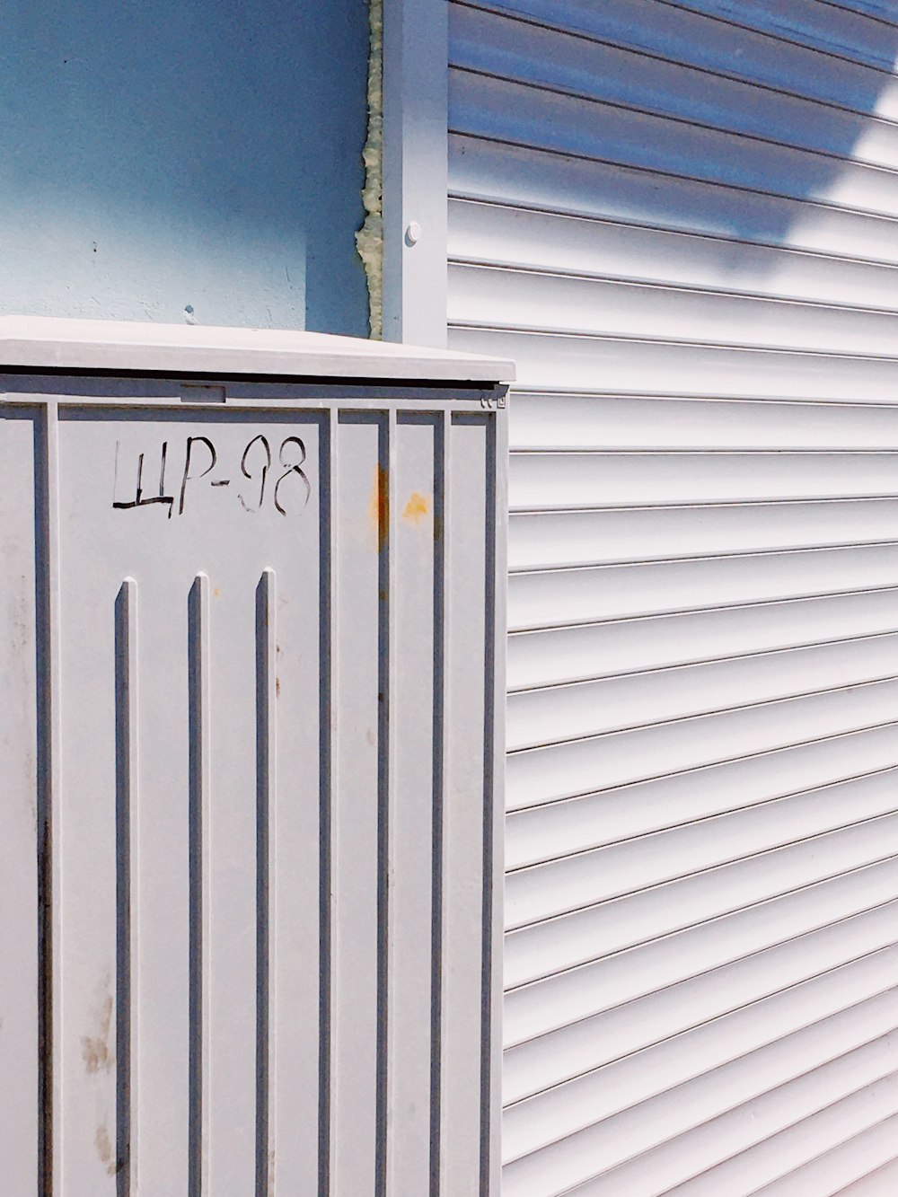 white and blue wooden garage door