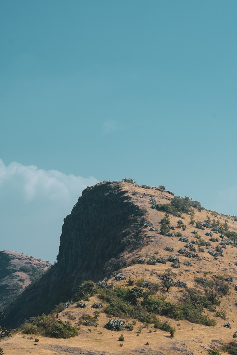 brown rock formation under blue sky during daytime