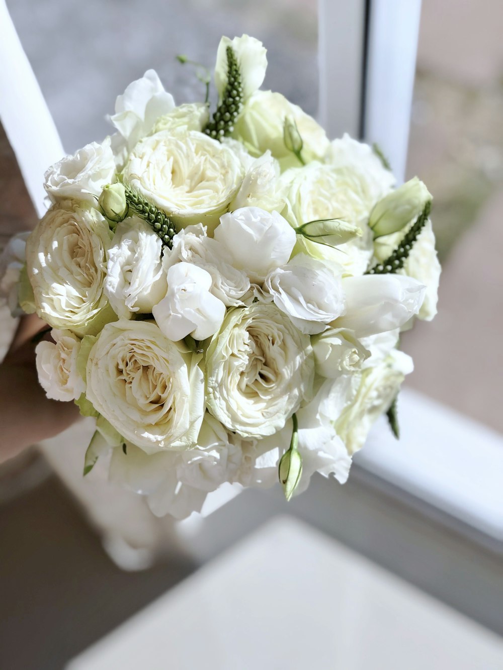 white and green bouquet of roses