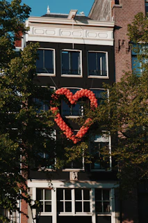 red heart shaped balloons on tree