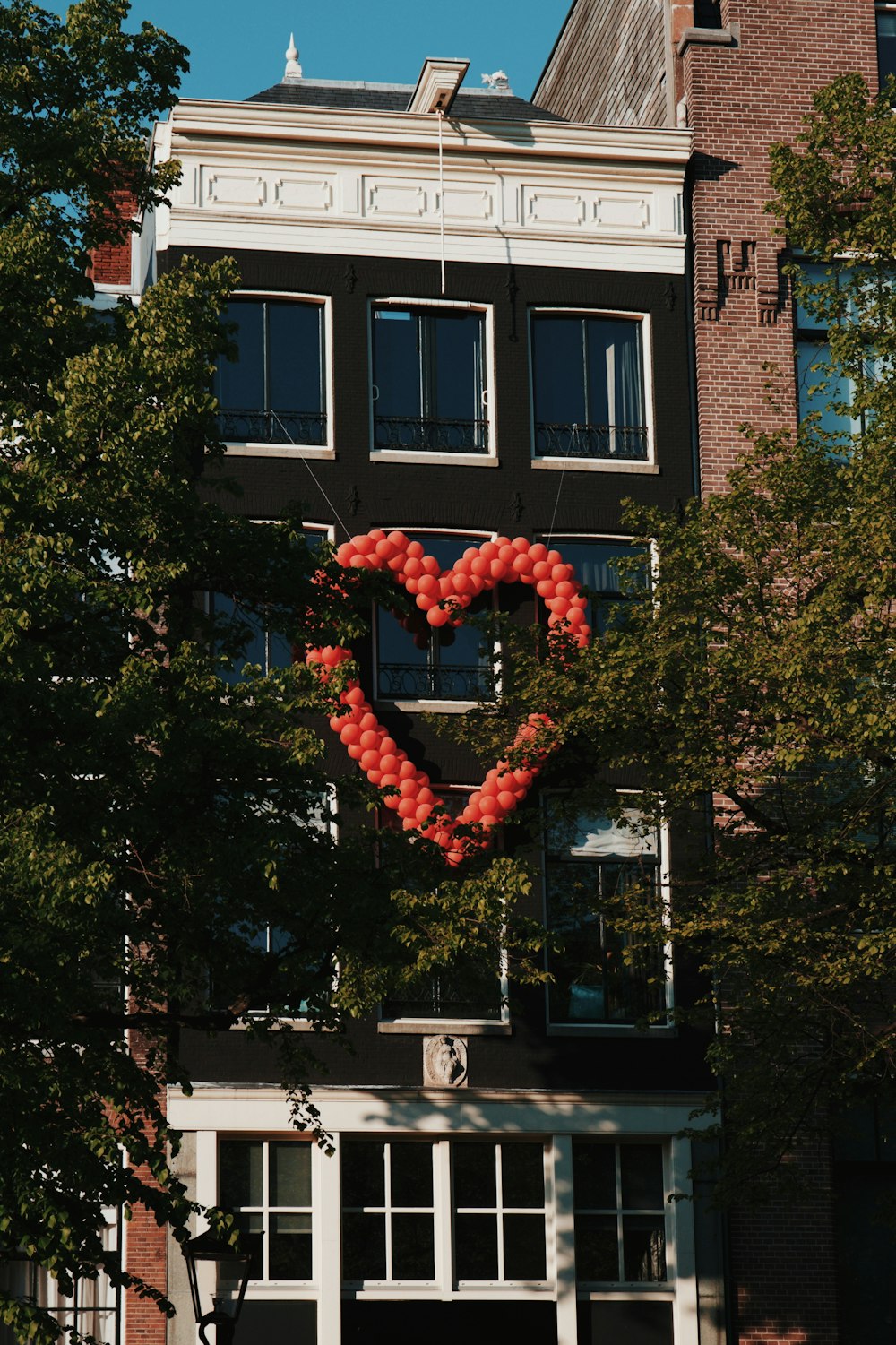 red heart shaped balloons on tree