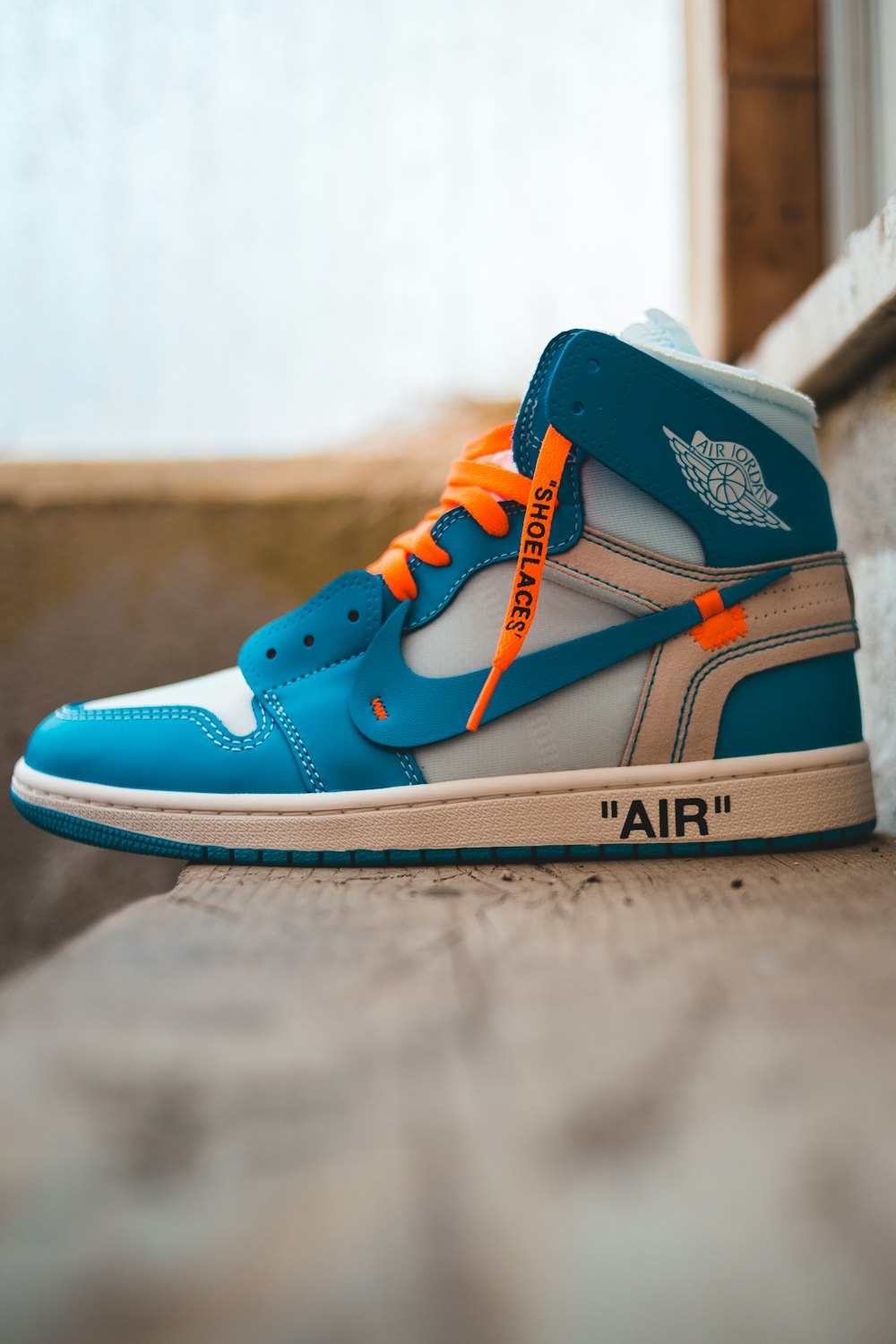 blue and black nike high top sneakers photo – Free Image on Unsplash
