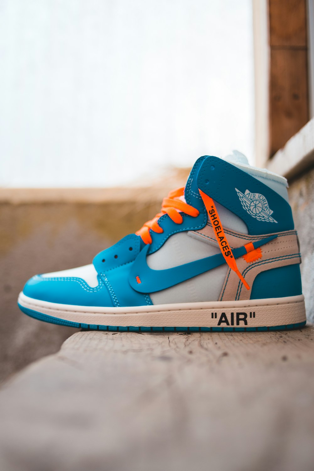 blue and orange nike high top sneakers photo – Free Image on Unsplash