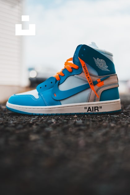 blue and orange nike high top sneakers photo – Free Footwear Image on  Unsplash