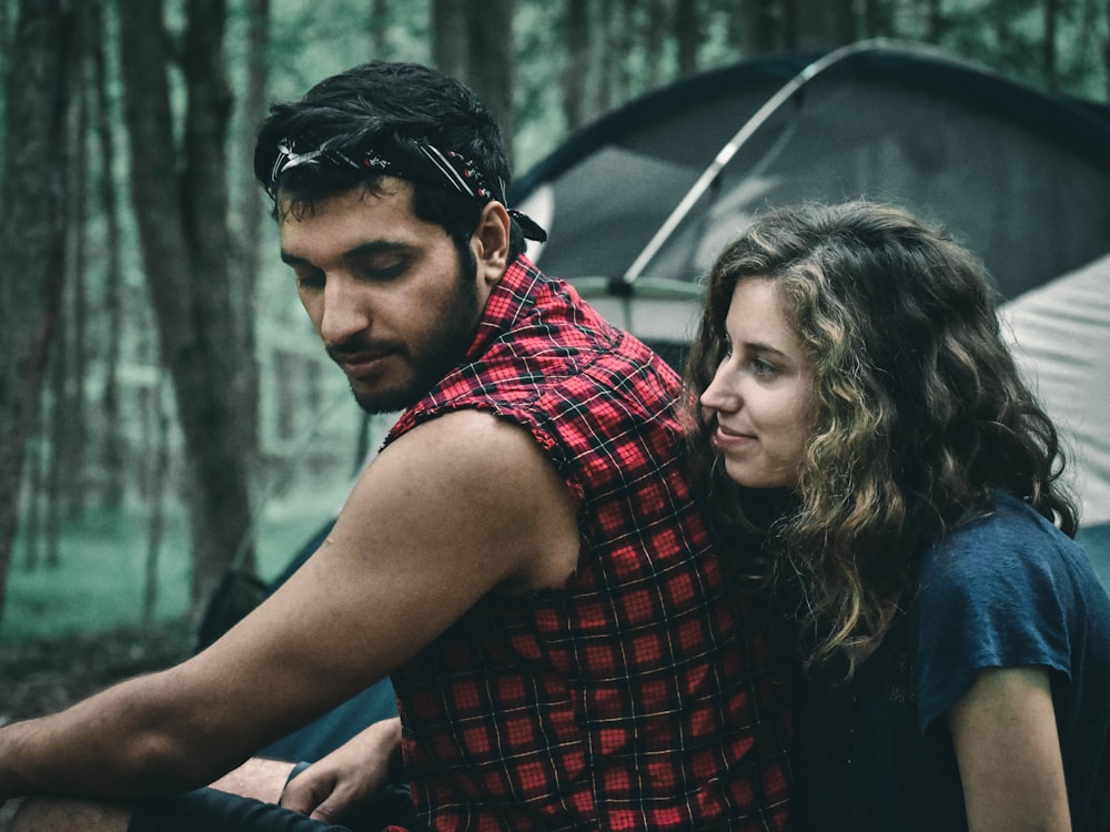 woman in red and black plaid shirt smiling