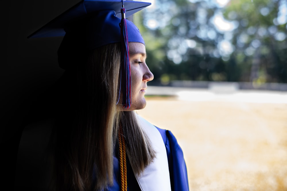 a woman in a graduation cap and gown