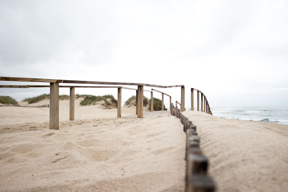 brown wooden dock on sea during daytime