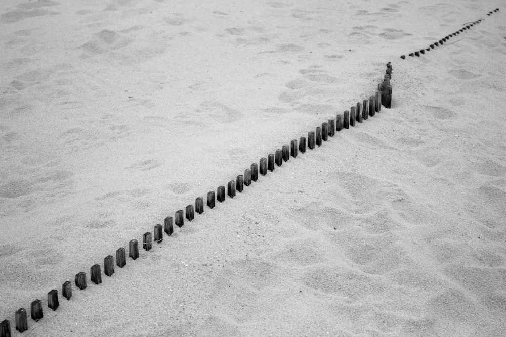 black and white rope on gray sand