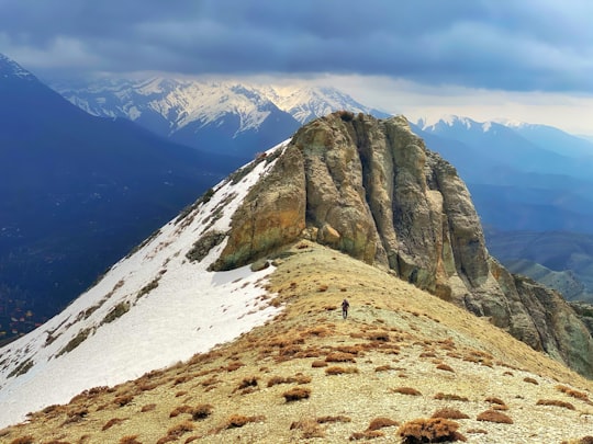 brown rocky mountain under white clouds during daytime in Fasham Iran