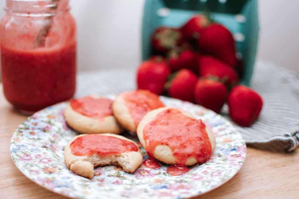 red and white heart shaped cookies on white and blue floral ceramic plate