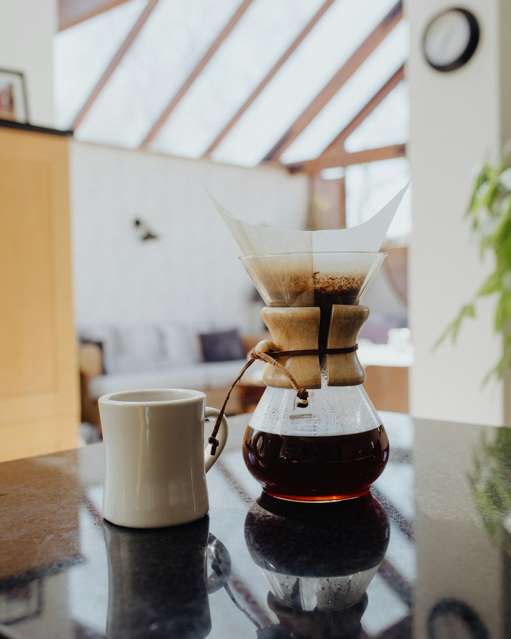 white ceramic mug on brown wooden table