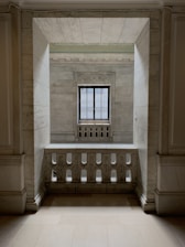 A serene Parisian beauty atelier interior with marble surfaces and soft linen textures.